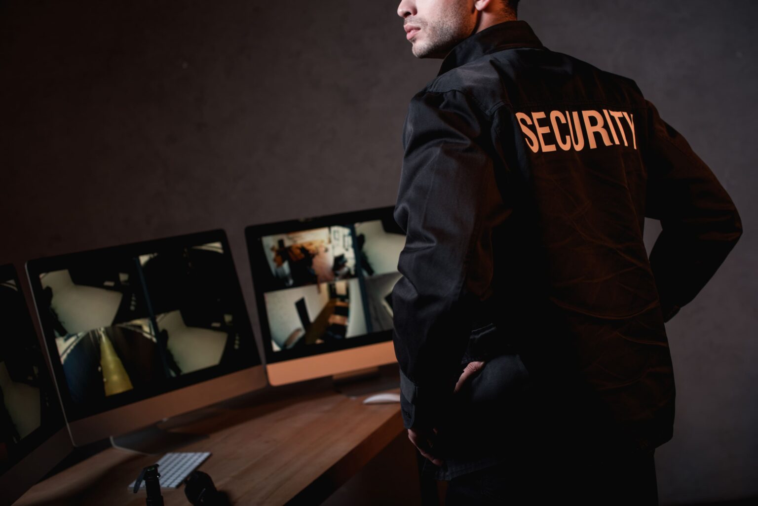 partial-view-of-guard-in-black-uniform-at-workplac-2024-11-17-17-00-16-utc