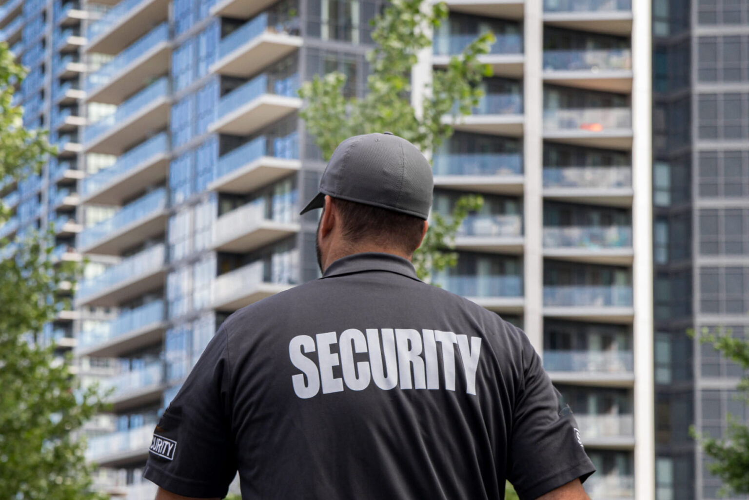 security-guard-in-uniform-patrolling-a-residential-2023-11-27-05-25-01-utc